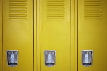 Photo of three yellow lockers with silver locks